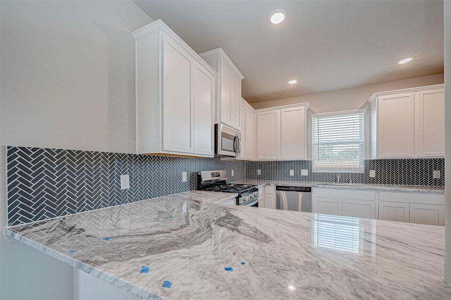Furnished interior view inside a new home in Mill Creek Trails, Magnolia (Image 8).