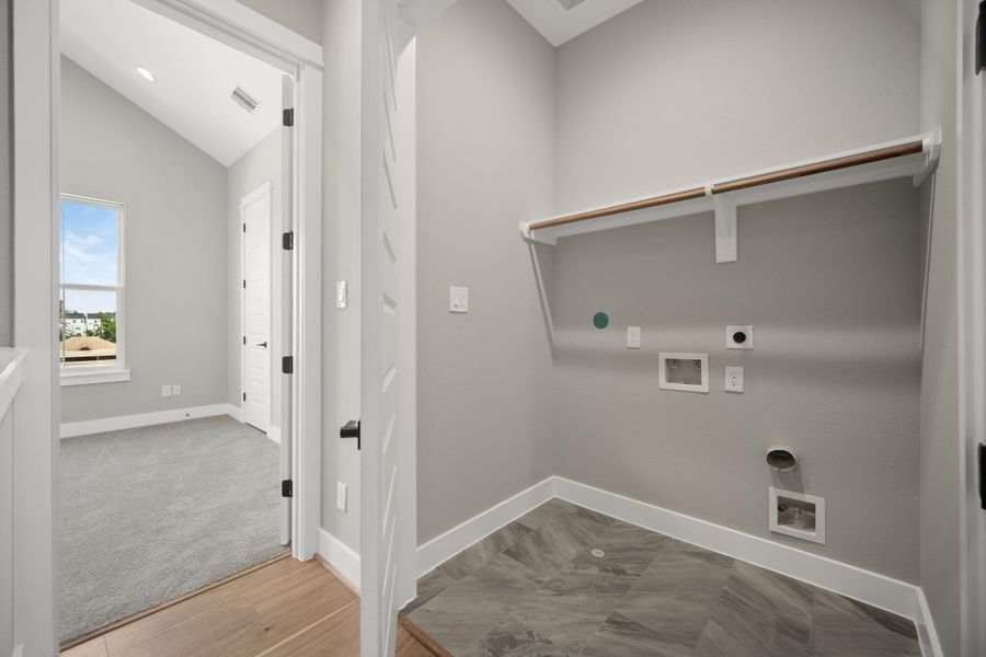 Utility room in house located on third level for convenience.