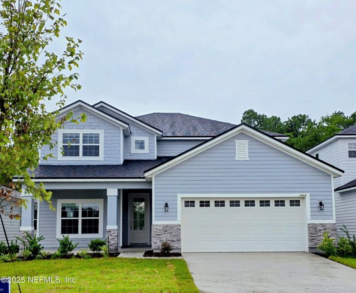 Front exterior of a new home in Hyland Trail, Green Cove Springs, FL, highlighting curb appeal (Image 2). Front exterior of a new home in Hyland Trail, Green Cove Springs, FL, highlighting curb appeal (Image 2).