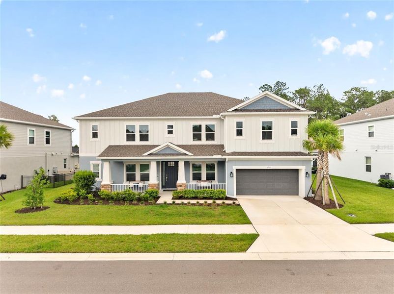 Front exterior of a new home in , Wesley Chapel, FL, highlighting curb appeal (Image 1). Front exterior of a new home in , Wesley Chapel, FL, highlighting curb appeal (Image 1).