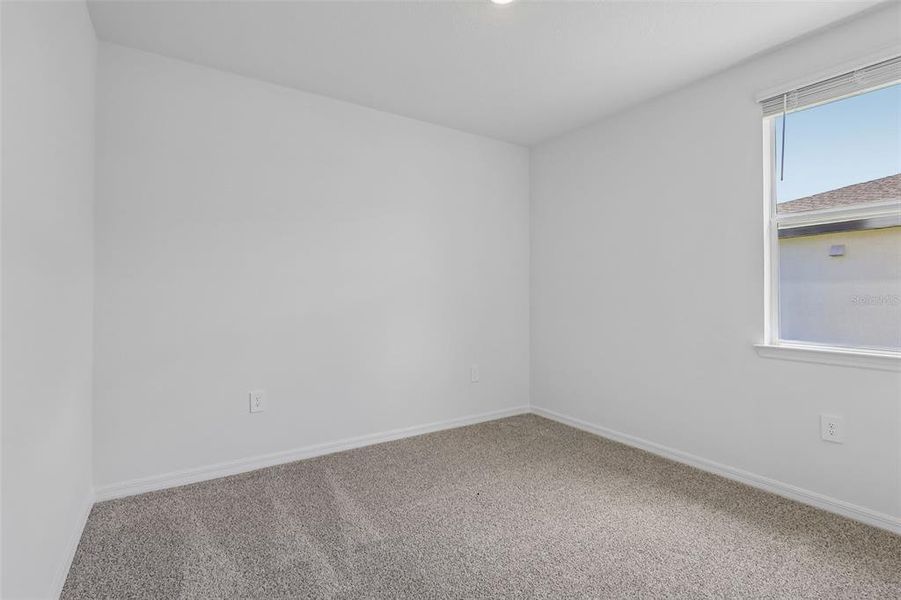 Spacious, unfurnished interior of a new home in The Grove at Stuart Crossing - Signature Series, Bartow (Image 28).