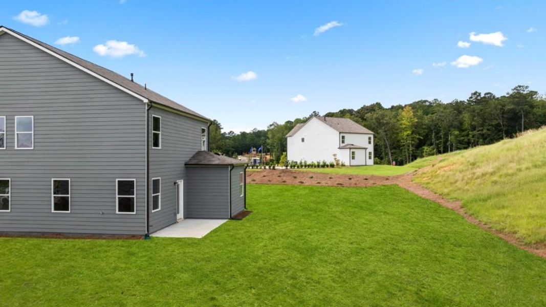 Front exterior of a new home in Sheffield Highlands, Dallas, GA, highlighting curb appeal (Image 27). Front exterior of a new home in Sheffield Highlands, Dallas, GA, highlighting curb appeal (Image 27).