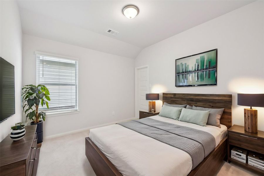 Welcome to this secondary bedroom. The gentle, luxurious carpet brings both comfort and sophistication, creating an ideal space for unwinding.