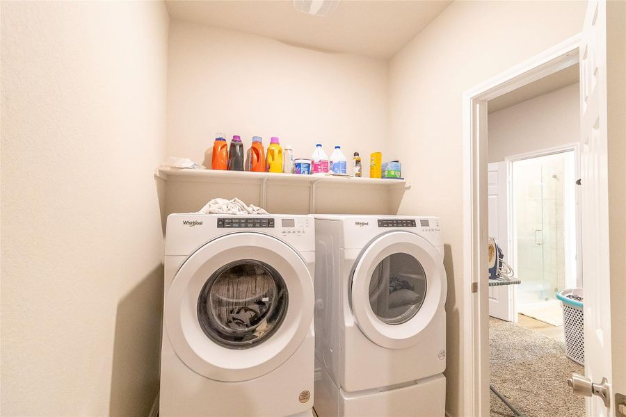 A well-equipped utility space featuring a washer and dryer for effortless household chores. A well-equipped utility space featuring a washer and dryer for effortless household chores.