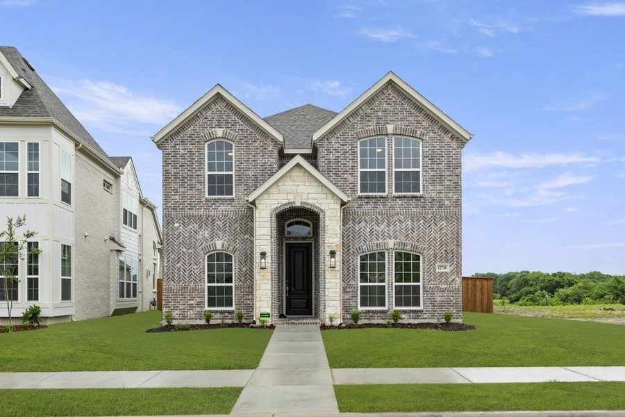 Front exterior of a new home in Trails at Cottonwood Creek, Rowlett, TX, highlighting curb appeal (Image 23). Front exterior of a new home in Trails at Cottonwood Creek, Rowlett, TX, highlighting curb appeal (Image 23).