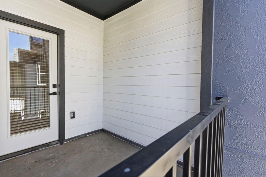 Private balcony located on an upper floor, offering an outdoor extension of the living space.