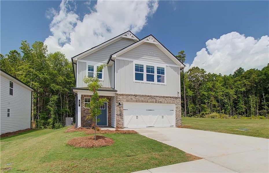 Front exterior of a new home in Enclave at Evergreen, Fairburn, GA, highlighting curb appeal (Image 2).