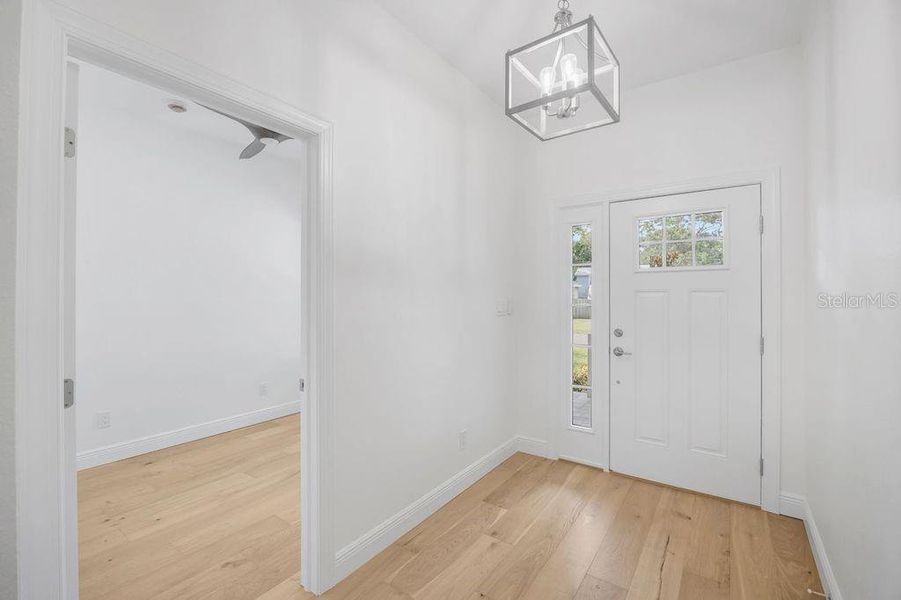 Front door and peeking into bedroom 4/office Front door and peeking into bedroom 4/office