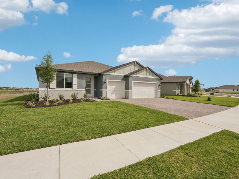 Front exterior of a new home in Oakfield Trails - Signature Series, Parrish, FL, highlighting curb appeal (Image 2). Front exterior of a new home in Oakfield Trails - Signature Series, Parrish, FL, highlighting curb appeal (Image 2).