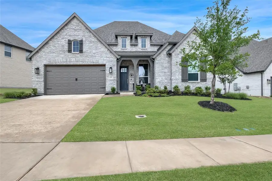 Front exterior of a new home in , Van Alstyne, TX, highlighting curb appeal (Image 24).