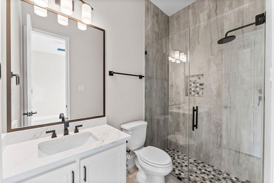 Secondary bath with walk-in shower, elegant finishes