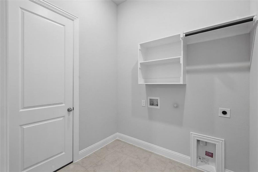 Laundry room featuring gas dryer hookup, washer hookup, and electric dryer hookup Laundry room featuring gas dryer hookup, washer hookup, and electric dryer hookup