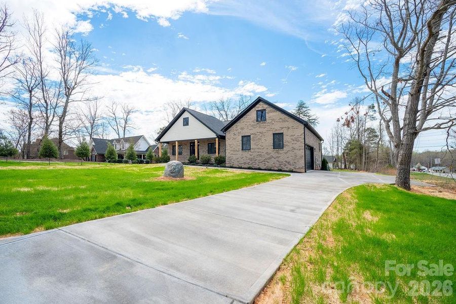 Front exterior of a new home in , Dallas, NC, highlighting curb appeal (Image 20).