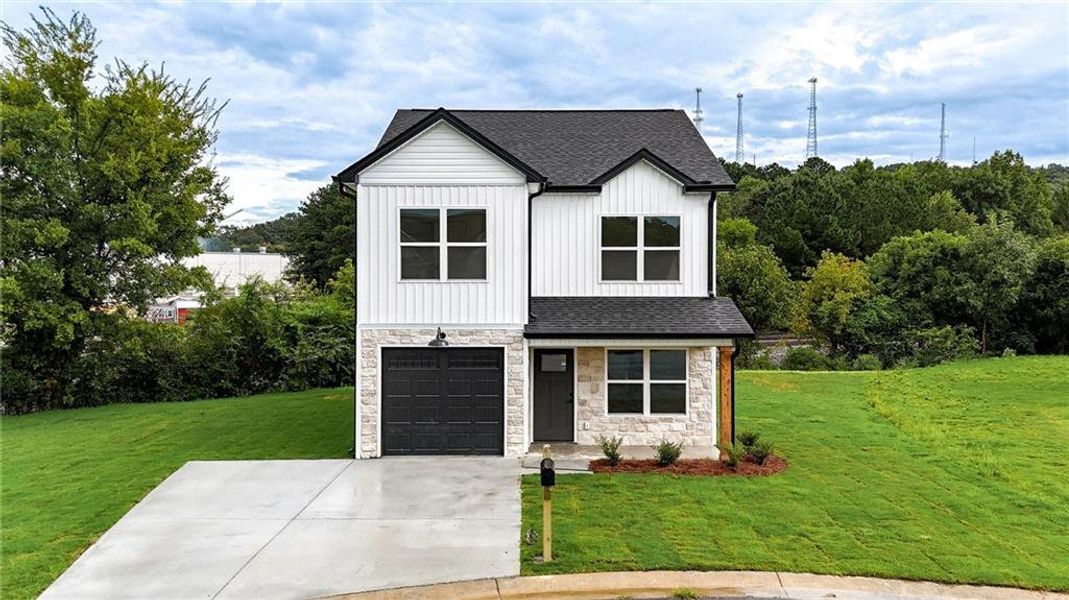 Front exterior of a new home in , Calhoun, GA, highlighting curb appeal (Image 21).