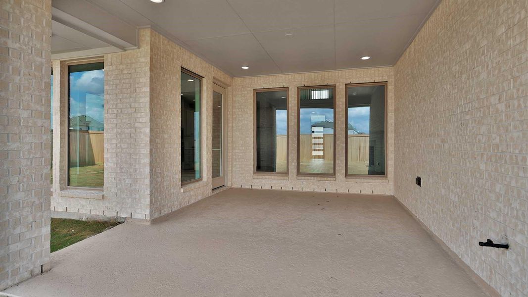 Exterior details and patio area of a home in Bridgeland, Cypress (Image 3).