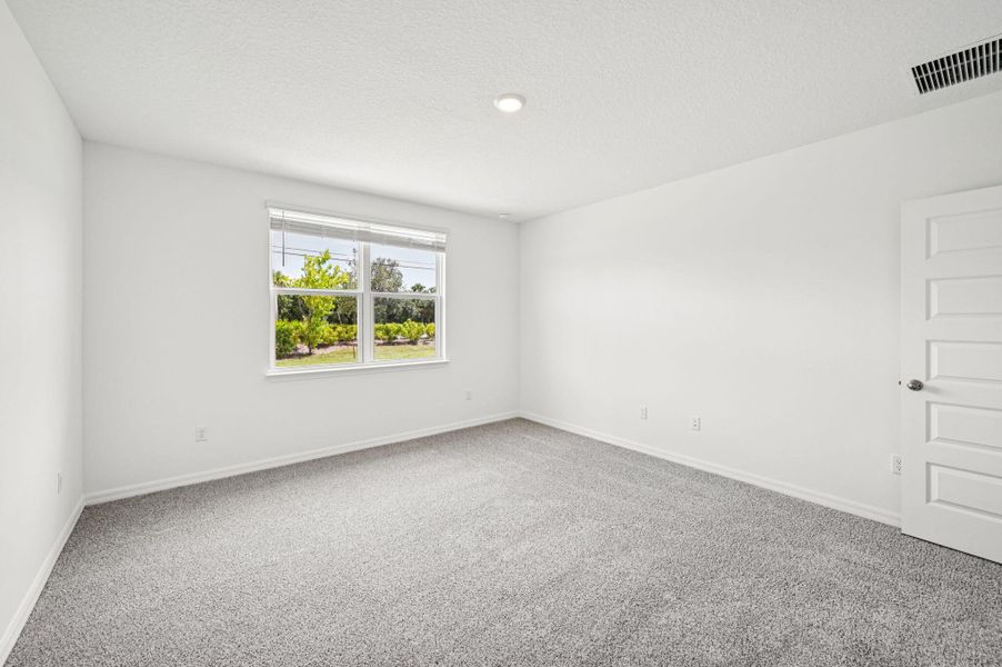 Spacious, unfurnished interior of a new home in Hampton Park - Classic Series, Vero Beach (Image 13).