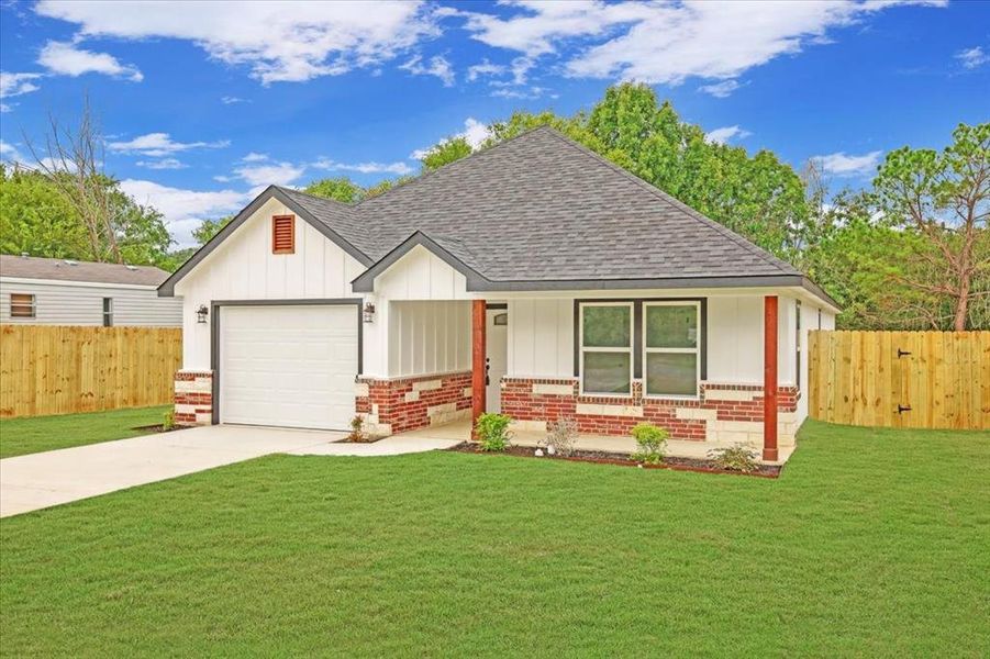 View of front of house featuring brick siding, a porch, roof with shingles, and board and batten siding View of front of house featuring brick siding, a porch, roof with shingles, and board and batten siding