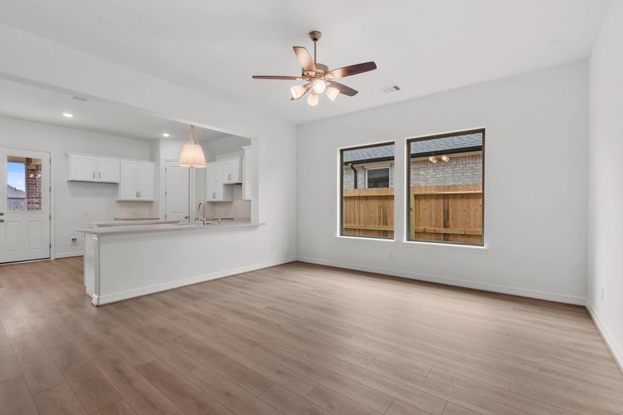 Gathering room.  Sample product photo. Actual exterior and interior selections may vary by homesite. Photo may be virtually staged.