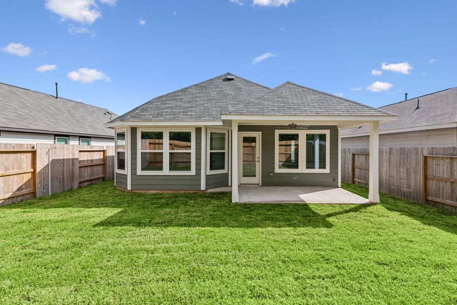 Exterior details and patio area of a home in Pinewood at Grand Texas, New Caney (Image 9).