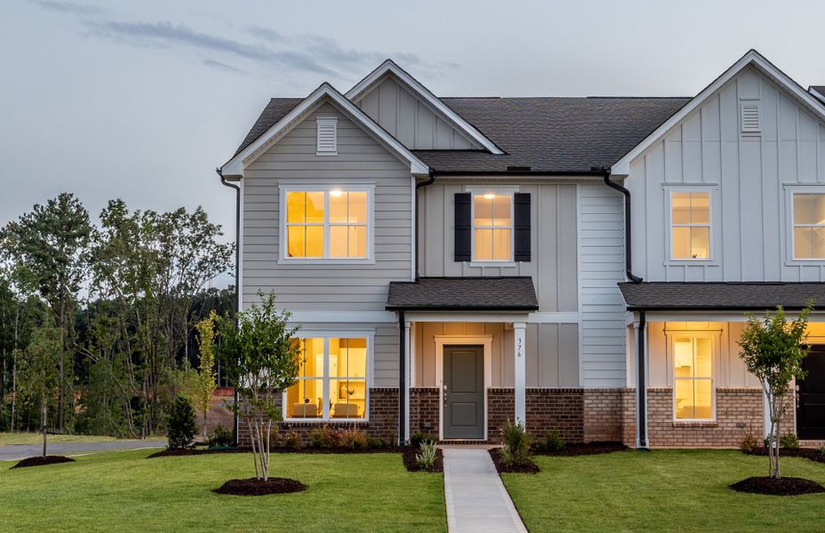 Front exterior of a new home in Exchange at 401, Raleigh, NC, highlighting curb appeal (Image 1). Front exterior of a new home in Exchange at 401, Raleigh, NC, highlighting curb appeal (Image 1).