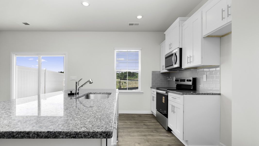 Furnished interior view inside a new home in The Gables at Edinborough Townes, Gibsonville (Image 8). Furnished interior view inside a new home in The Gables at Edinborough Townes, Gibsonville (Image 8).