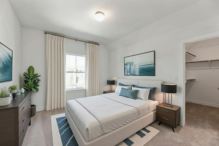 Bedroom with light carpet, a walk in closet, and vaulted ceiling Bedroom with light carpet, a walk in closet, and vaulted ceiling