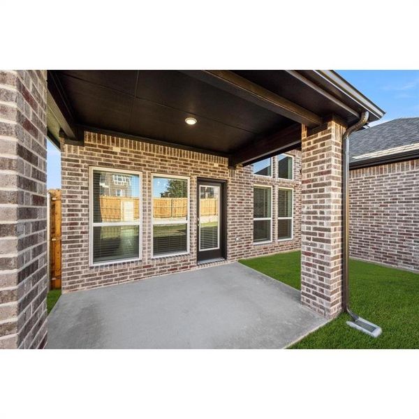 Front exterior of a new home in The Villages at Charleston, Glenn Heights, TX, highlighting curb appeal (Image 21).
