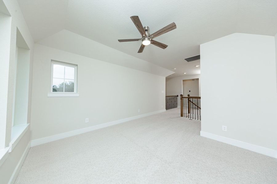 Additional view from Game Room looking out towards stairs and hallway leading to secondary bedrooms and bathroom.
