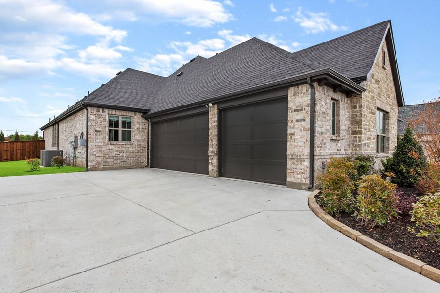 Front exterior of a new home in NorthGlen, Haslet, TX, highlighting curb appeal (Image 21). Front exterior of a new home in NorthGlen, Haslet, TX, highlighting curb appeal (Image 21).