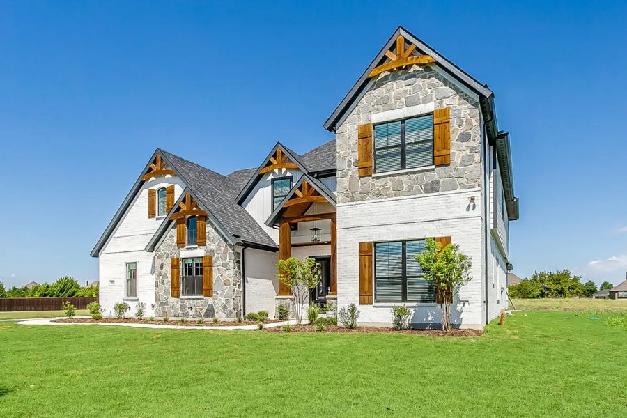 Representative exterior photo of a completed home built from the The Peyton by Elmwood Custom Homes in Matthews Farm, Venus, TX (Image 4). Representative exterior photo of a completed home built from the The Peyton by Elmwood Custom Homes in Matthews Farm, Venus, TX (Image 4).