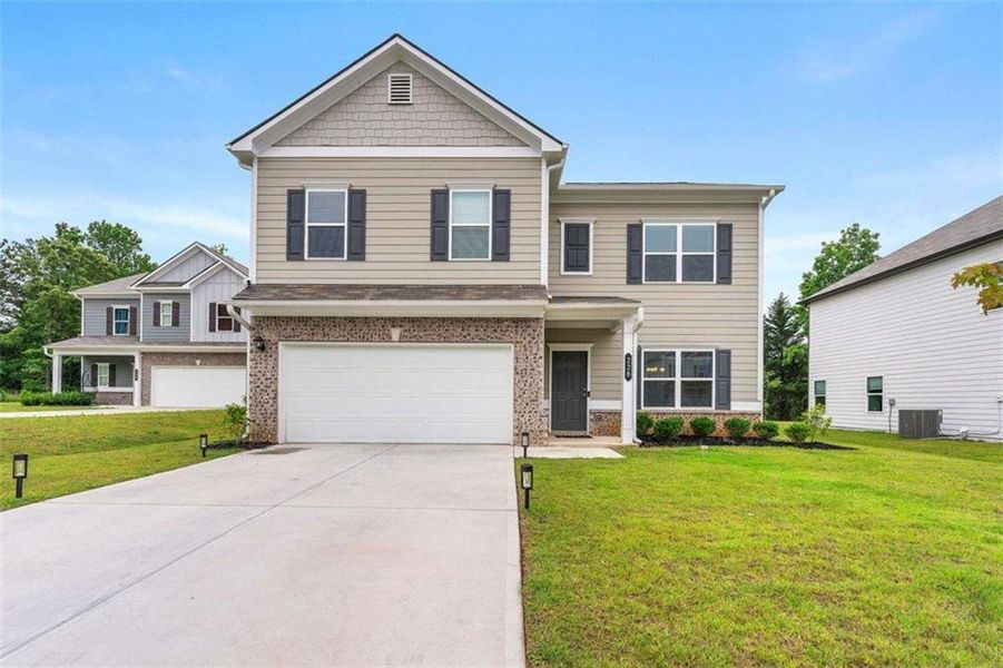 Front exterior of a new home in , Dallas, GA, highlighting curb appeal (Image 1). Front exterior of a new home in , Dallas, GA, highlighting curb appeal (Image 1).