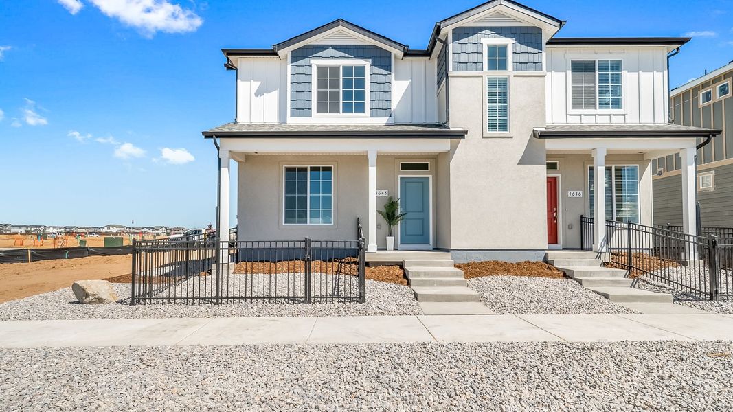 Front exterior of a new home in Green Valley Ranch, Aurora, CO, highlighting curb appeal (Image 1). Front exterior of a new home in Green Valley Ranch, Aurora, CO, highlighting curb appeal (Image 1).