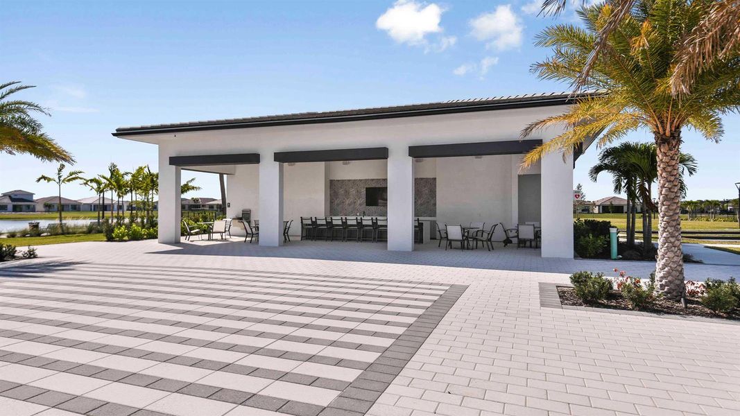 Front exterior of a new home in Cresswind Palm Beach at Westlake, Westlake, FL, highlighting curb appeal (Image 1).