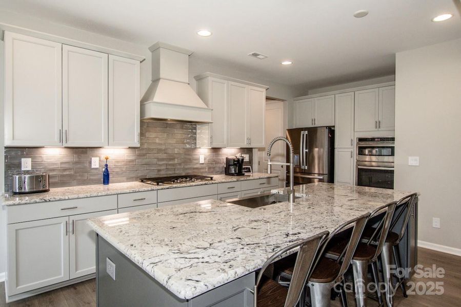 Furnished interior view inside a new home in Signature at Reid's Cove, Mooresville (Image 28).
