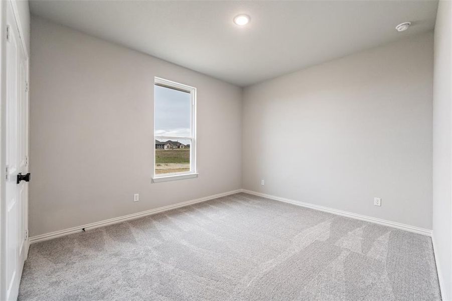 Spare room with light colored carpet and recessed lighting Spare room with light colored carpet and recessed lighting