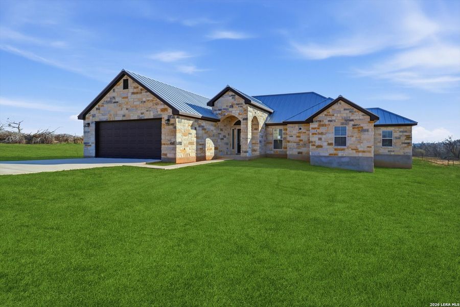 Front exterior of a new home in , St. Hedwig, TX, highlighting curb appeal (Image 2). Front exterior of a new home in , St. Hedwig, TX, highlighting curb appeal (Image 2).