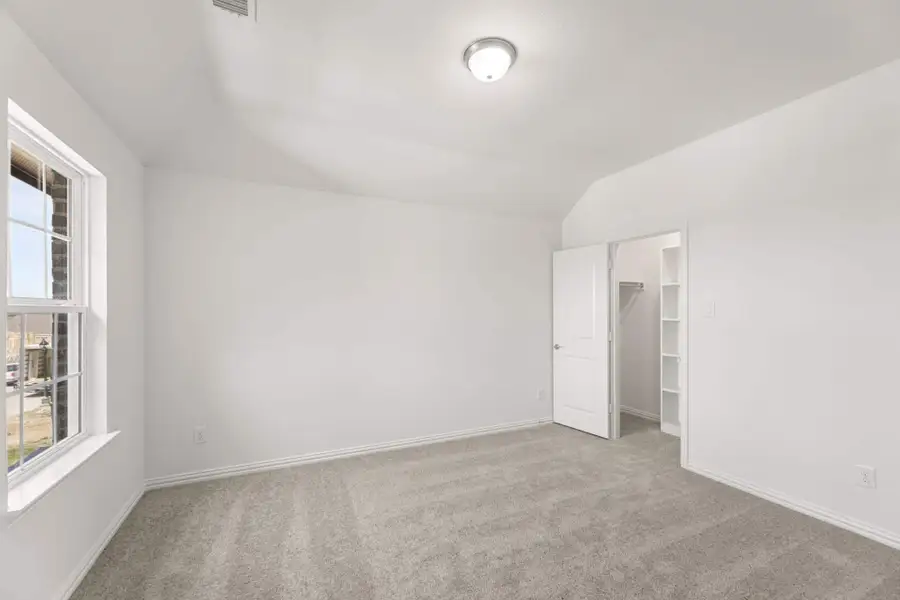 Representative unfurnished interior of a home built from the Walton by UnionMain Homes in Elevon, Lavon (Image 36).