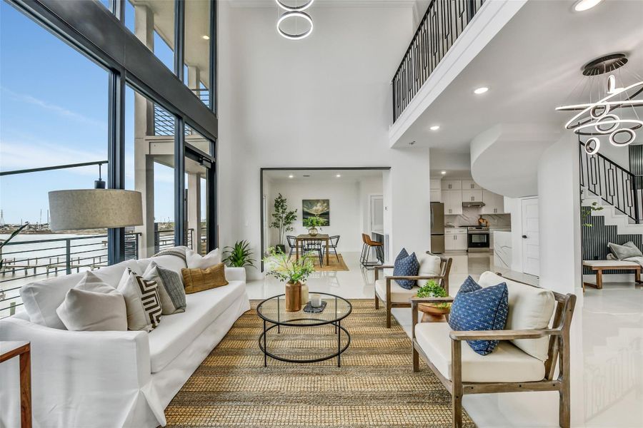 The scale of this room allows for both intimate moments and grand entertaining. It’s easy to imagine hosting guests while the water glistens in the background.