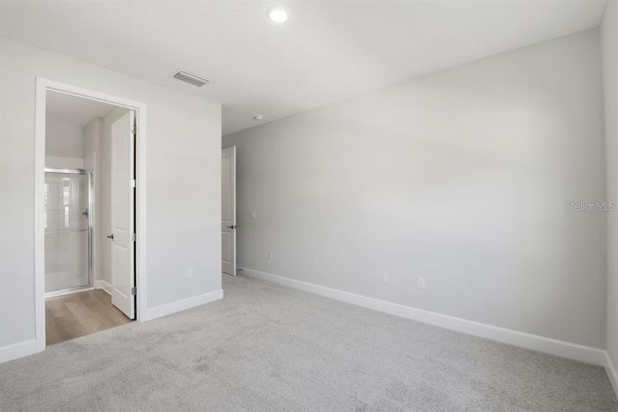 Spacious, unfurnished interior of a new home in Harvest at Ovation, Winter Garden (Image 24).