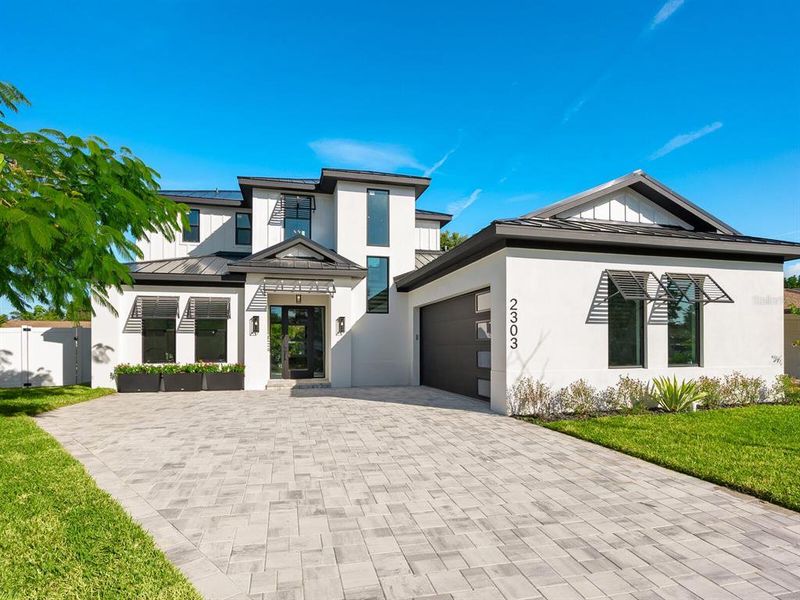 Front exterior of a new home in , Sarasota, FL, highlighting curb appeal (Image 27).