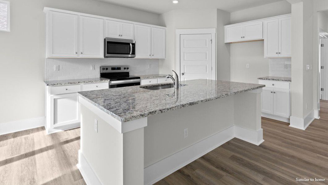 Representative furnished interior of a home built from the Martin by D.R. Horton in Merchant Point, Jacksonville (Image 7).