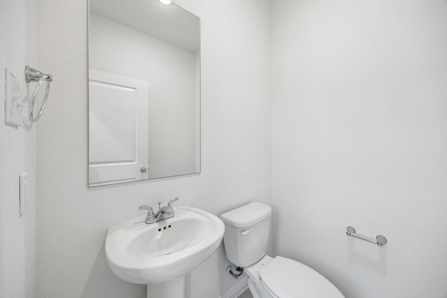 Half Bath in the Magnolia home plan by Trophy Signature Homes – REPRESENTATIVE PHOTO