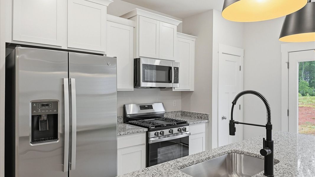 Accomplished layout with a first-class kitchen in this select villa community by DRB Homes Accomplished layout with a first-class kitchen in this select villa community by DRB Homes