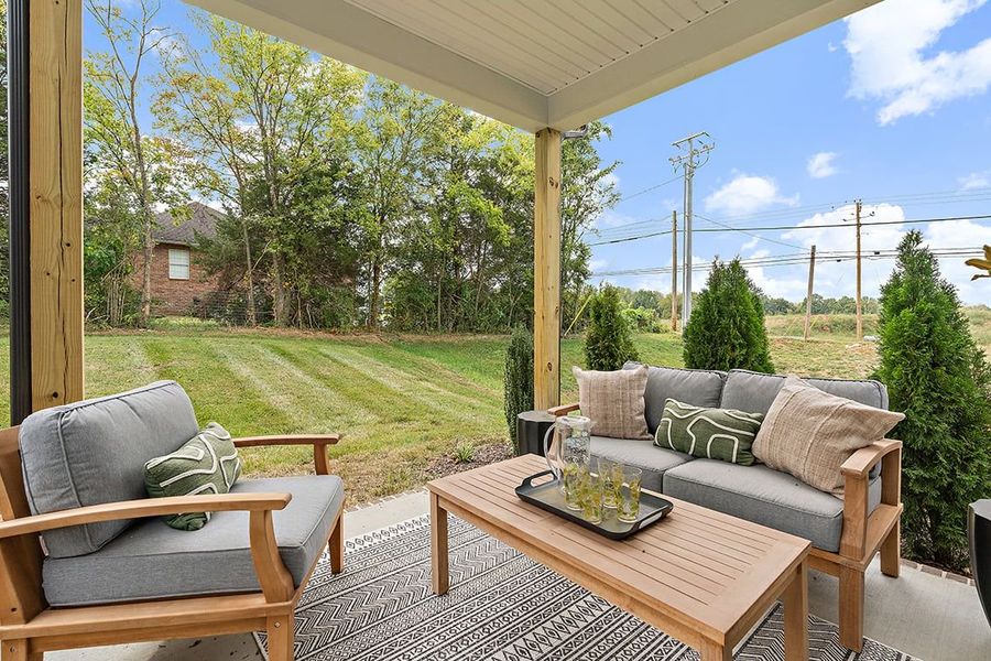 A patio with a table and chairs. A patio with a table and chairs.