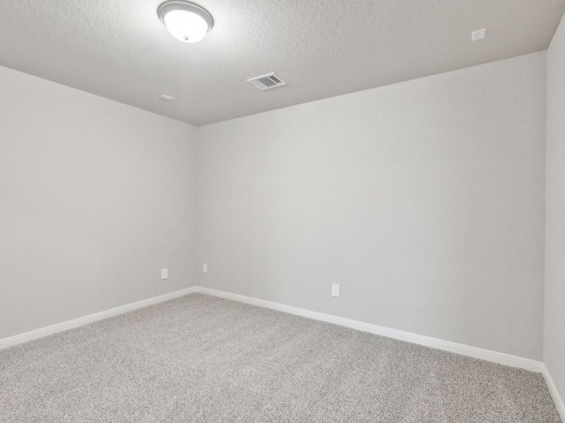 Guest bedroom in the San Jacinto floorplan at a Meritage Homes community.