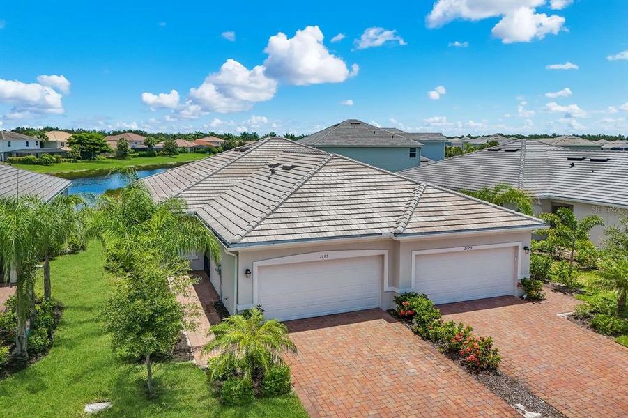 Front exterior of a new home in , Naples, FL, highlighting curb appeal (Image 2). Front exterior of a new home in , Naples, FL, highlighting curb appeal (Image 2).