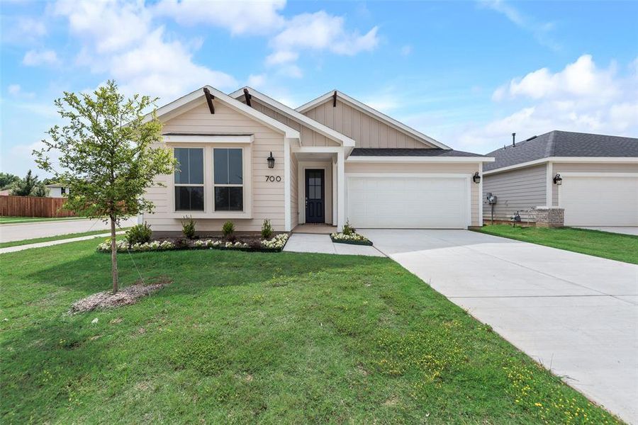 Front exterior of a new home in Creekside of Crowley, Crowley, TX, highlighting curb appeal (Image 19). Front exterior of a new home in Creekside of Crowley, Crowley, TX, highlighting curb appeal (Image 19).