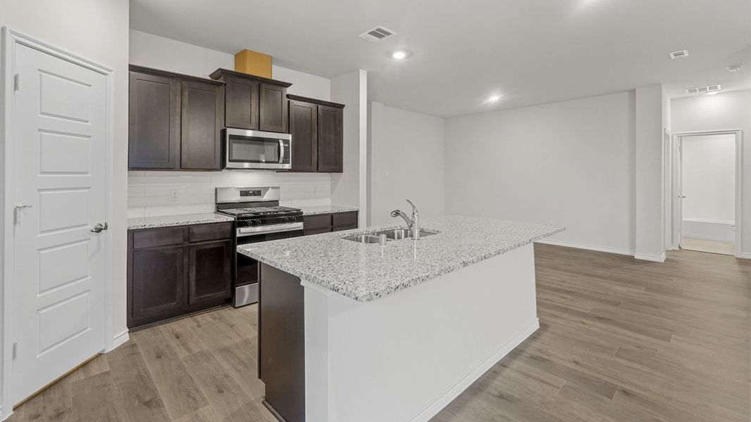 Furnished interior view inside a new home in Fireside by the Lake, Garland (Image 4).