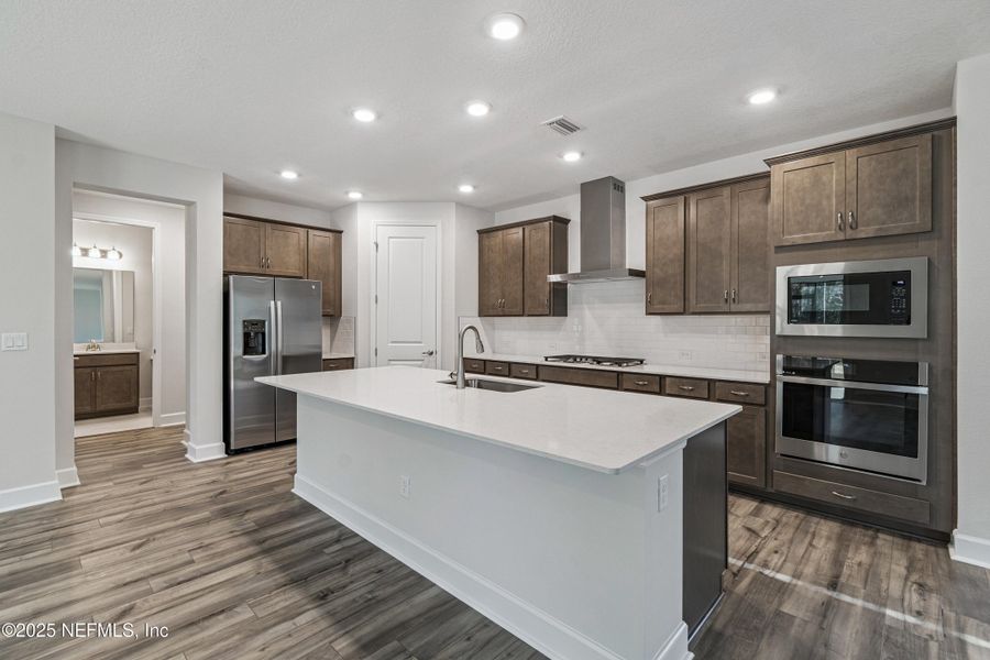 Furnished interior view inside a new home in Tributary 70', Yulee (Image 7).