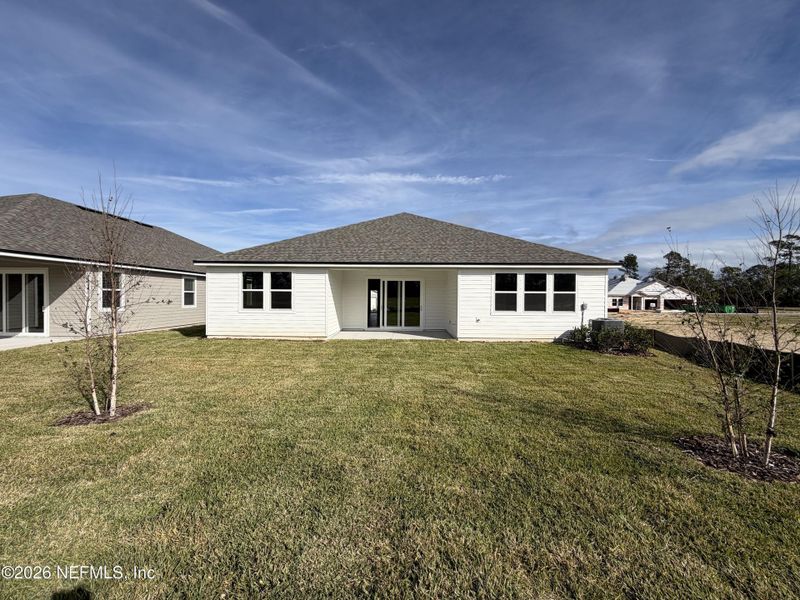Exterior details and patio area of a home in The Cypress Series at Reserve East, Flagler Beach (Image 18).